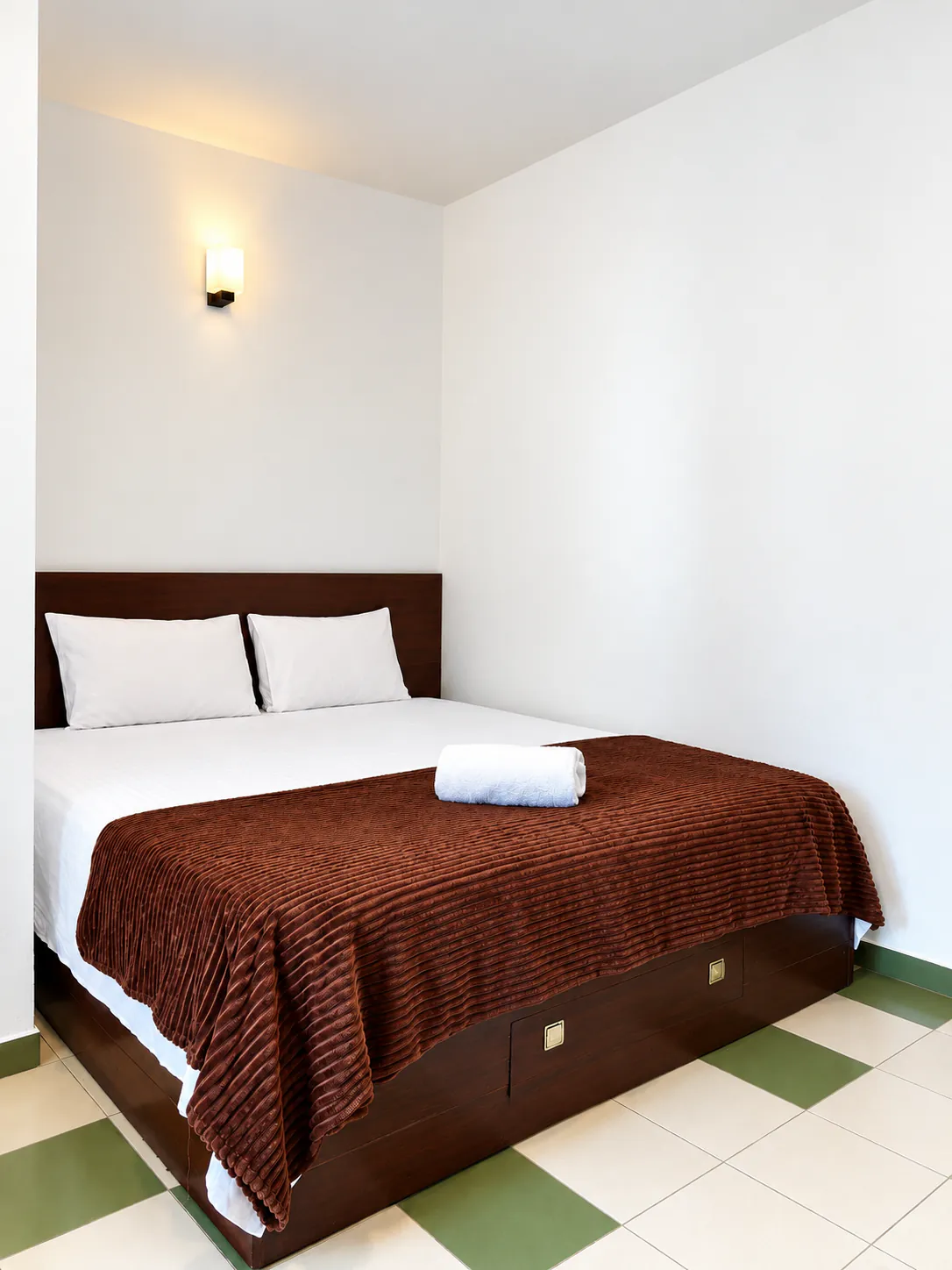 Cozy double room with wall fan