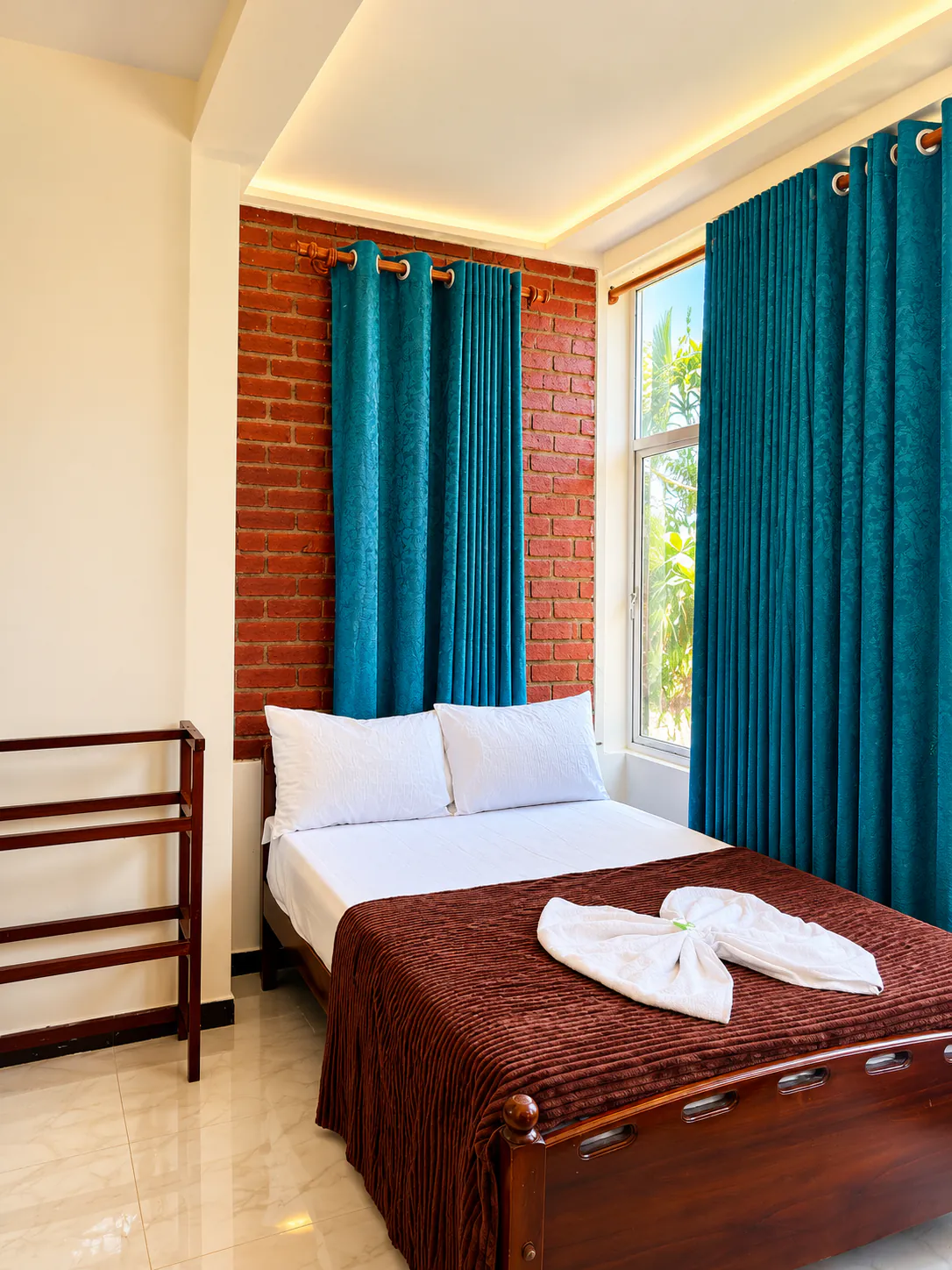Garden room with carved wooden bed